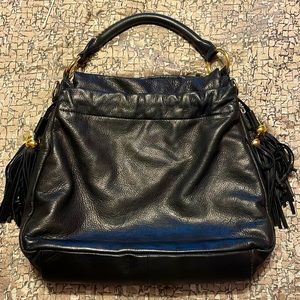A leather black and gold purse. Very cute and spacious